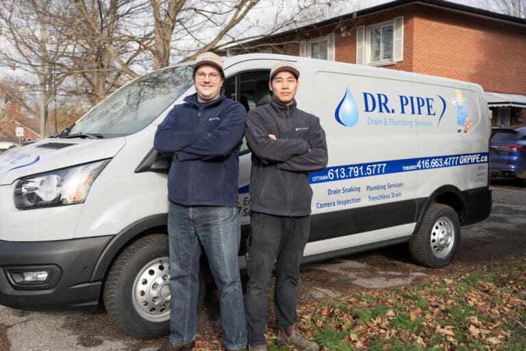 Dr. Pipe technicians in front of the service van arriving for sewer drain replacement in Ottawa