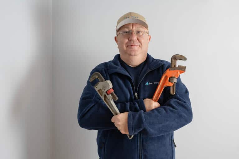 Dr. Pipe technician with tools in hand, arriving for toilet repair service in Ottawa