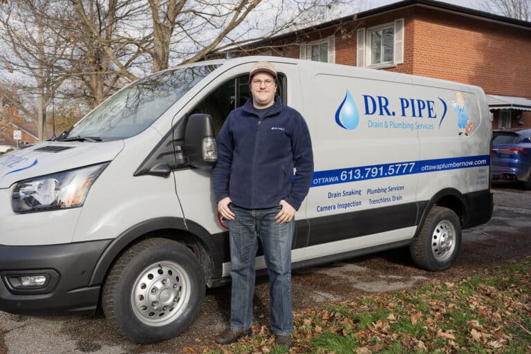 Dr. Pipe technician in front of a service van for floor drain and downspout cleaning in Ottawa