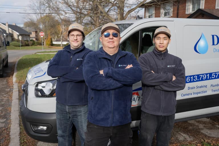 Dr. Pipe technician in front of a service van for drain cleaning in Ottawa