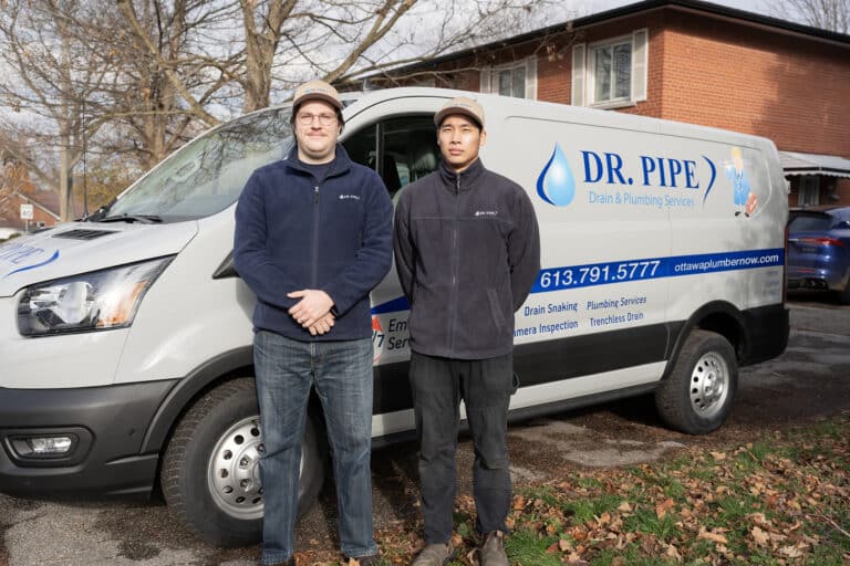 Dr. Pipe technicians in front of a service van for hydro jetting service in Ottawa