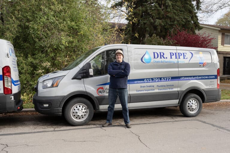 Dr. Pipe technician in front of a service van for clogged sink repair in Ottawa