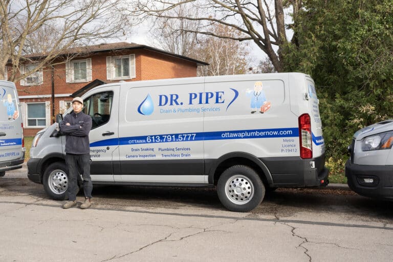 Dr. Pipe technician in front of a service van for washing machine plumbing service in Ottawa